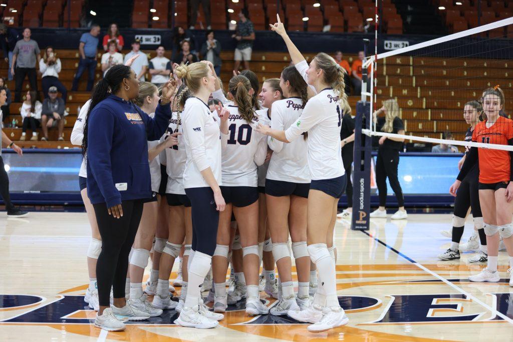 The Waves celebrate the win against Oregon State University on Nov. 30 at Firestone Fieldhouse. The Waves won in five sets for their final game of the regular season. Photos courtesy of Jeff Golden