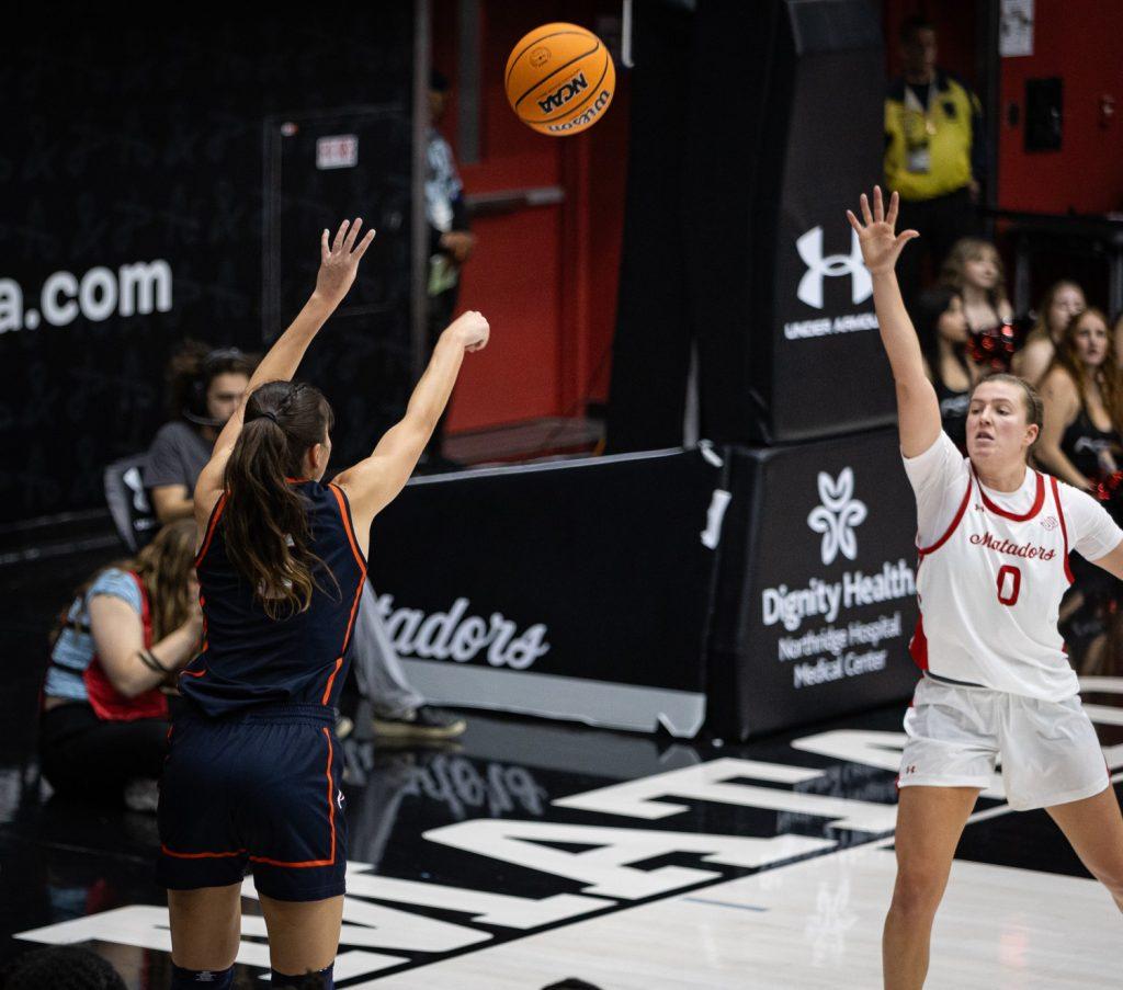 Senior guard Malia Mastora shoots a three-pointer against the Matadors at Premier America Credit Union Arena on Nov. 27. The Mastora sisters scored 27 points in the dominant Waves win.