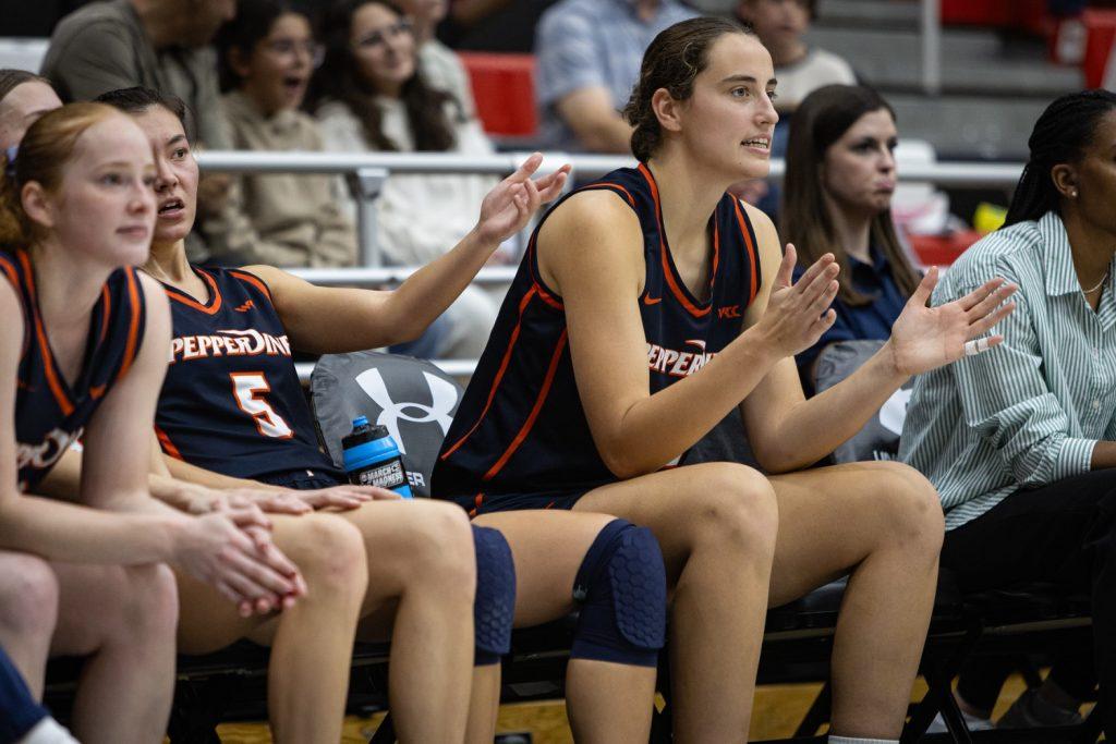 (Left to right) Graduate guard Ornela Muca, senior guard Malia Mastora and Megan Harkey, senior forward/center and Graphic sports staff writer, rest on the bench against CSUN on Nov. 27 at Premier America Credit Union Arena. This trio combined for 37 points, 18 rebounds, 12 assists and 11 blocks in the win.