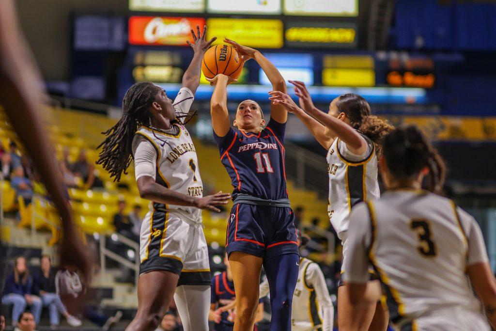 Senior guard Helena Friend goes for a shot against Long Beach State on Dec. 1 in the Walter Pyramid. Pepperdine lost the game 61-68. Photos courtesy of Joseph Kling/Joseph Kling Photography