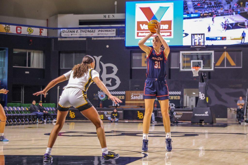 Megan Harkey, senior forward/center and Graphic sports staff writer, takes a shot against Long Beach State on Dec. 1 in the Walter Pyramid. Harkey was one of three Pepperdine players with double-digit points after scoring 10 points for the Waves.