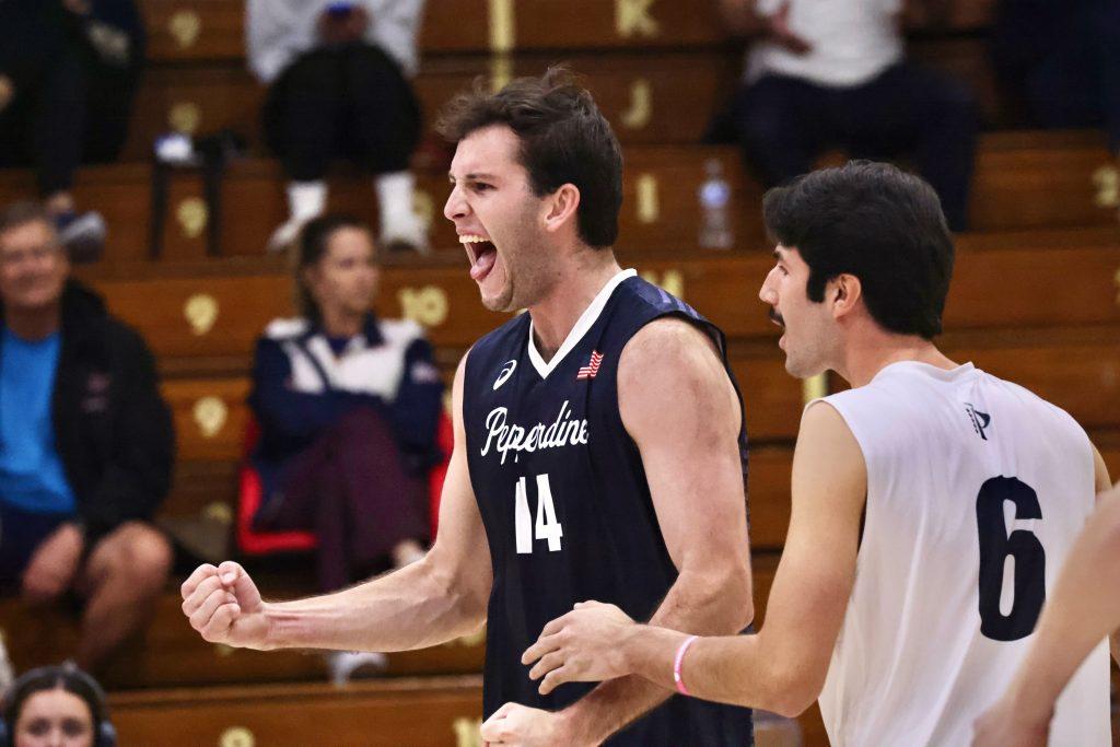 Barnett and Reilly cheer after a point for the Waves in their sweep against Missouri S&T. The Waves won two sets by double-digits in their season opener.