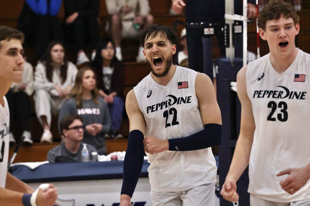 Freshman outside hitter Jose Gomez celebrates his kill against Emmanuel University at Firestone Fieldhouse on Jan. 20. Gomez was one of the leading scorers of the match, even energizing the crowd with his three aces in a row. Photos courtesy of Pepperdine Athletics