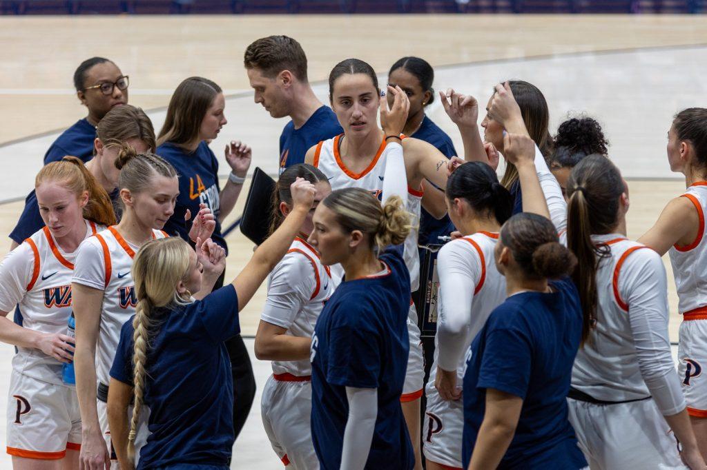 The Waves prepare to break a huddle against the University of the Pacific at Firestone Fieldhouse on Jan. 23. Pepperdine's matchup against Pacific is the first of two games in a three day span for the Waves. Photos by Colton Rubsamen