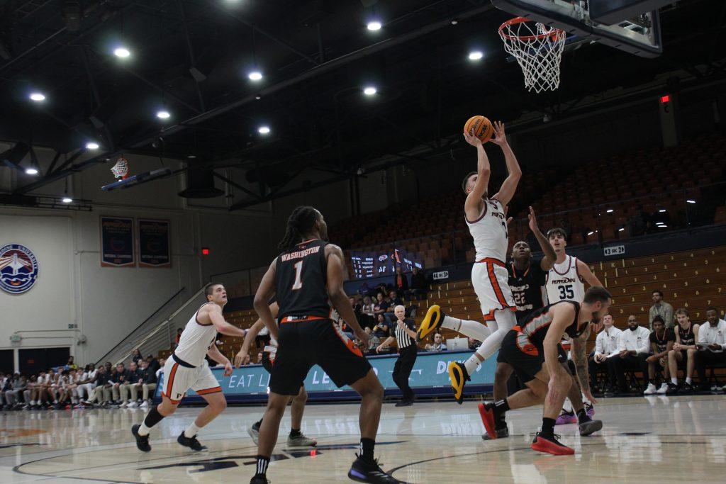 Senior forward Stefan Todorovic goes up for a jump shot at Firestone Fieldhouse on Jan. 25. Todorovic made four out of five free throws in this game.