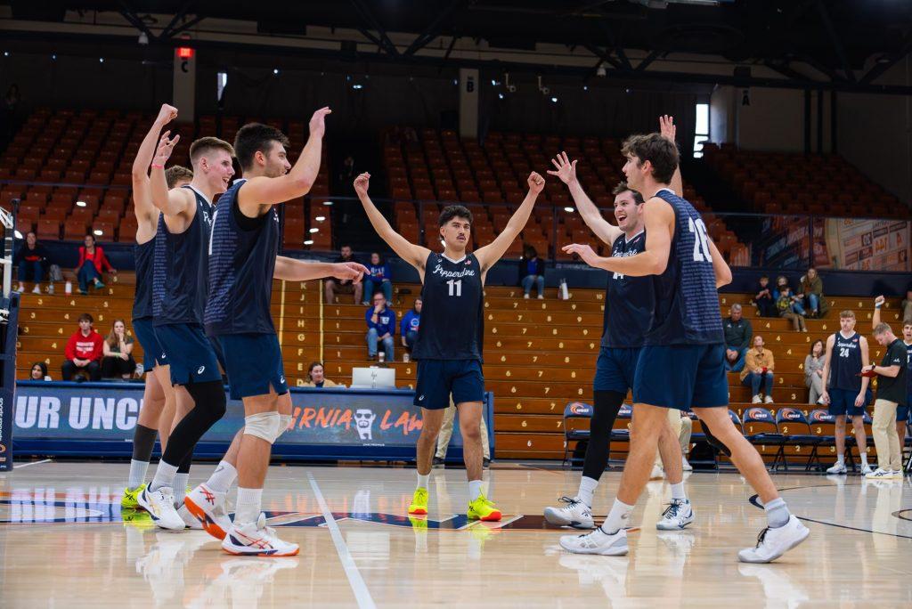 Graves and his teammates celebrate a point against D'youville University on Jan. 13, at Firestone Fieldhouse. Graves has accumulated 632 assists so far in his Waves career. Photo courtesy of Ryan Graves