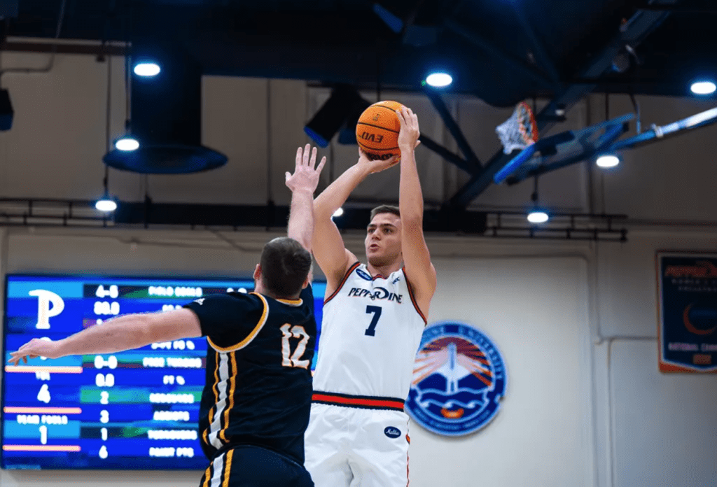 Senior forward Stefan Todorovic shoots a contested shot against Life Pacific University on Dec. 4 in Firestone Fieldhouse. Todorovic, along with guard Zion Bethea, led Pepperdine in points with 16-apiece. Photos courtesy of Pepperdine Athletics