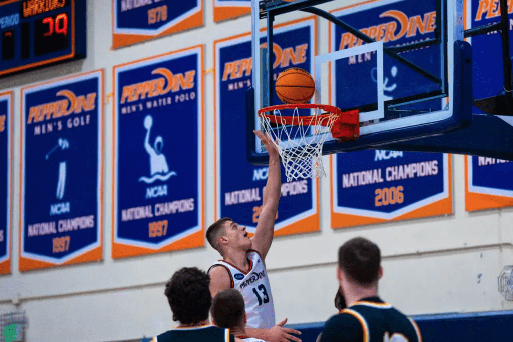 Sophomore guard/forward Dovydas Butka breaks through Pacific's defense to score a layup Dec. 4 at Firestone Fieldhouse. The Waves seek to lengthen their win streak against Grambling State University on Dec. 7 in Firestone Fieldhouse.