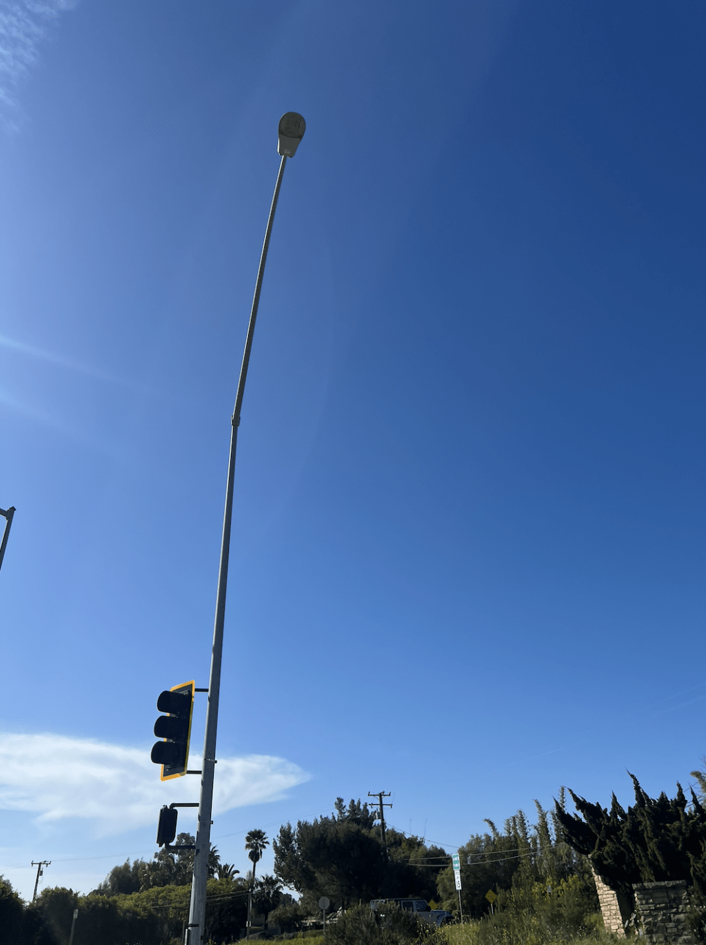 A PCH street lamp stands turned off in the middle of the day March 11, near Point Dume. The street lamps have been regulated by Caltrans and powered by Southern California Edison. Photo by Ava Heinert