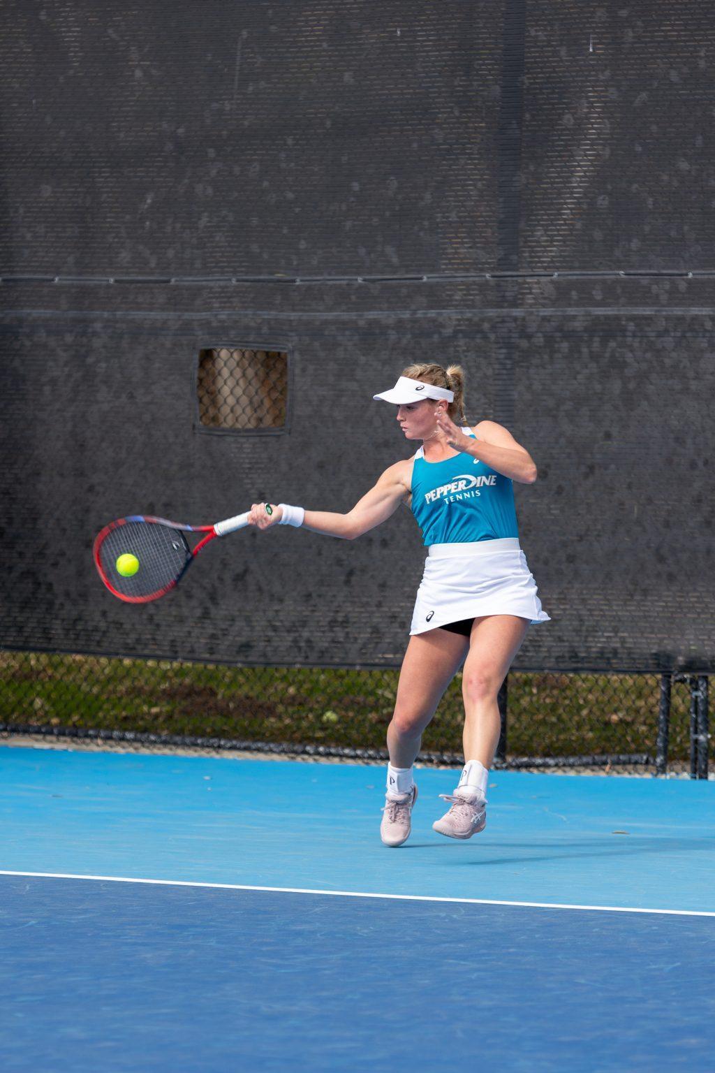 Freshman tennis player Taylor Goetz swings at a ball against Arizona on Jan. 25 at the Ralphs-Straus Tennis Center. Goetz was unable to finish her singles match, but won her doubles competition with freshman tennis player Anastasiia Grechkina.