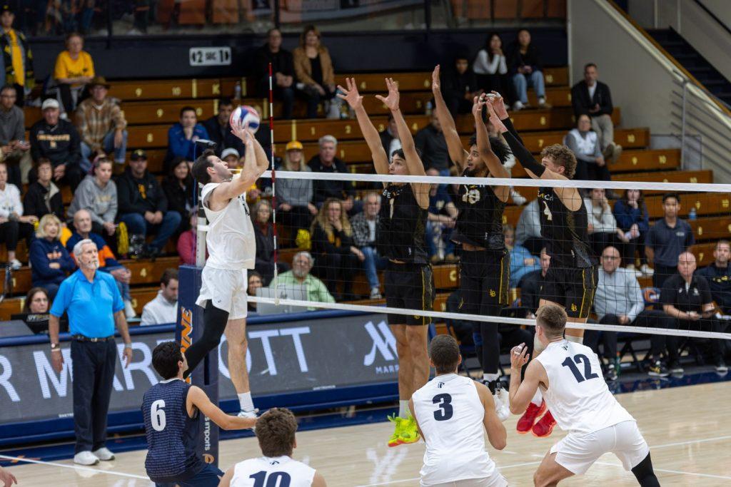 Junior outside hitter Ryan Barnett lobs it over the net for the point against Long Beach State on Jan. 26 at Firestone Fieldhouse. Barnett now has 38 points on the season.