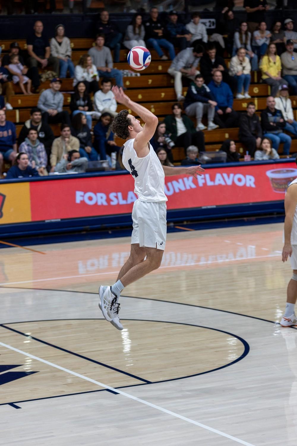 Senior libero Brendan Read serves the ball against Long Beach State on Jan. 26 at Firestone Fieldhouse. Read has 10 assists and 19 service aces.