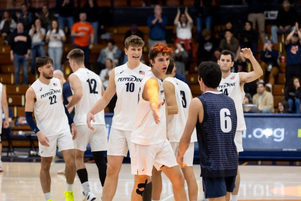 The Waves celebrate after winning the set against Long Beach State on Jan. 26 at Firestone Fieldhouse. This marks 20 sets won for Men’s Volleyball this season.