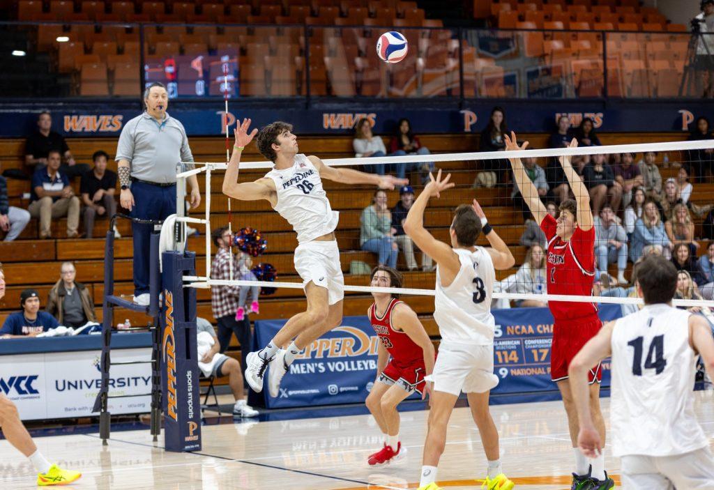 James Eadie, redshirt sophomore middle blocker goes up for a kill in Firestone Fieldhouse on Feb. 8. Eadie had 10 kills throughout the game. Photos by Colton Rubsamen