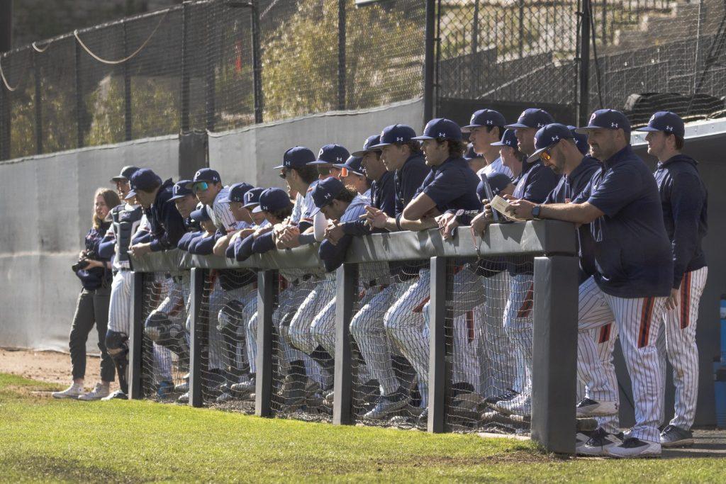 Pepperdine Baseball standing along the railing as they await the first pitch of the 2025 season opener against the University of Utah on Feb. 14, at Eddy D. Field Stadium. Photos by Kasten Grimm