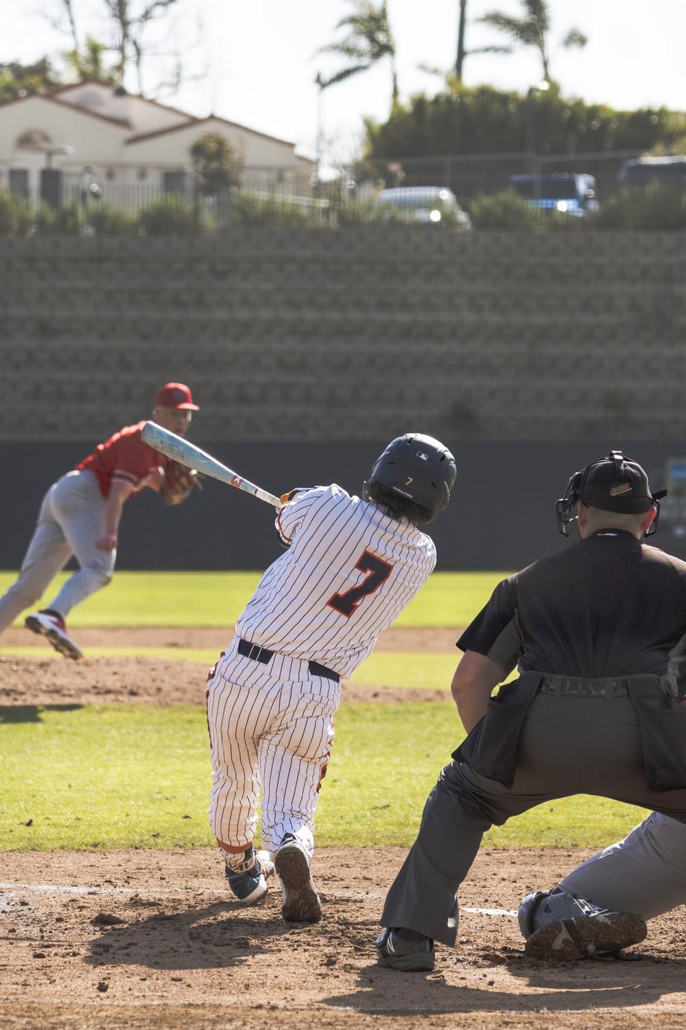 Senior infielder Julian Nunez swings at a pitch from Utah at Eddy D. Field Stadium on Feb. 14. Nunez recorded the sole run for the Waves with a solo homer in the first.