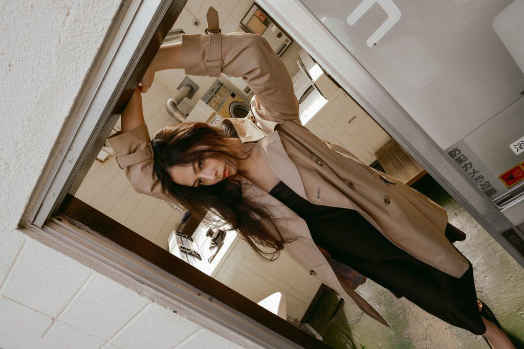 Japanese model Maily poses in the doorway of a building in Tokyo in Feb. 2024. Cheung did a photoshoot with the local model during her trip with Fujifilm and got ramen with her afterwards.