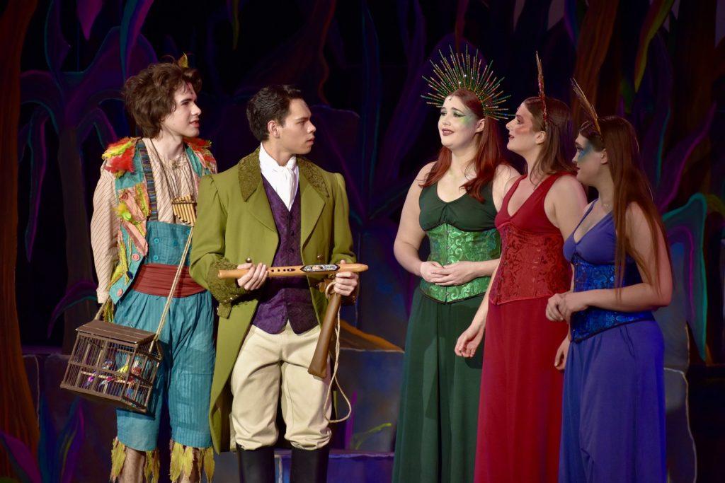 Papageno (left) and Tamino (second from left) are confronted by the Three Ladies during a Feb. 25 dress rehearsal of "The Magic Flute." Tamino held the titular instrument, which senior flautist Abby Grant synced to from the pit orchestra. Photos by Mary Elisabeth