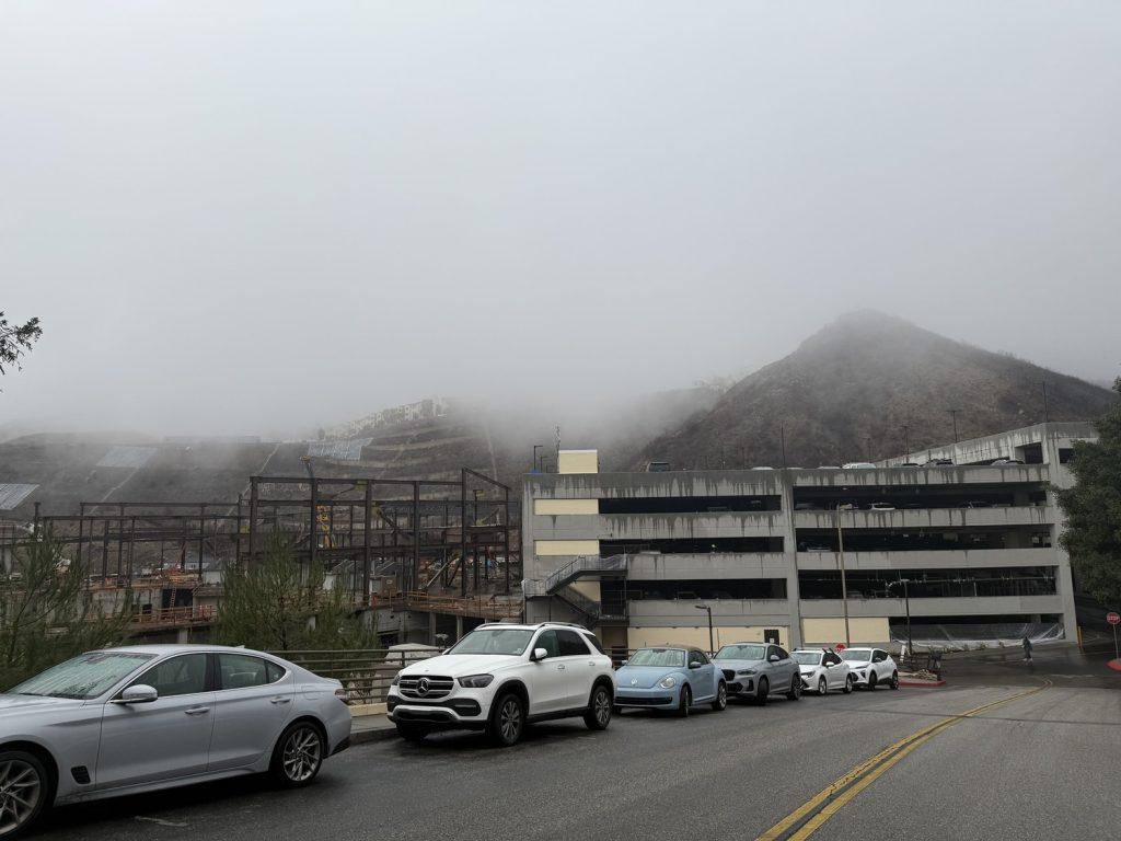 The newly-opened Mountain Parking Structure sits in front of a fog-covered hillside on a rainy day Feb. 5. The structure opened Jan. 20 and added 825 new parking spaces to campus. Photo by Amanda Monahan