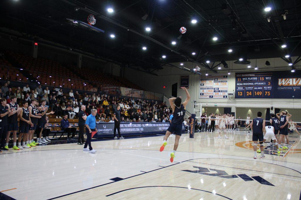 Freshman setter Ryan Graves performs a topspin serve at Firestone Fieldhouse on Jan. 30. Pepperdine had six aces in the game.