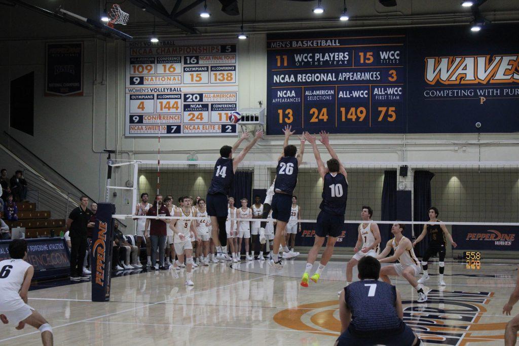 Ryan Barnett, redshirt junior outside hitter, James Eadie, redshirt sophomore middle blocker and Cole Hartke put up a triple block in Firestone Fieldhouse on Jan. 30. Pepperdine finished the game with a total of six and a half blocks.