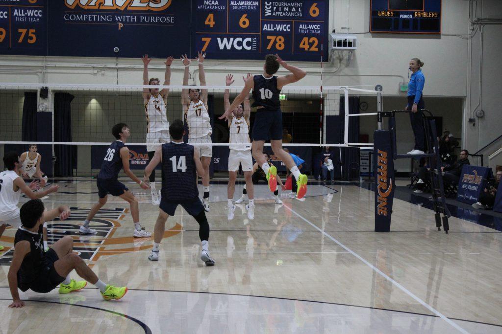 Freshman outside hitter Cole Hartke goes to spike the ball on Loyola University Chicago in Firestone Fieldhouse on Jan. 30. Hartke had a total of 24 kills in this game. Photos by Riley Haywood