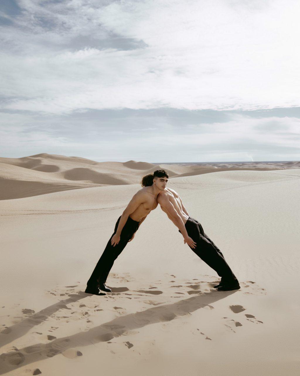 Tyre Lang and Hadi Hajomar lean on one another during one of Cheung’s photoshoots at the Glamis Sand Dunes in January 2023. Cheung said she wanted to emphasize composition with the dunes in the back.