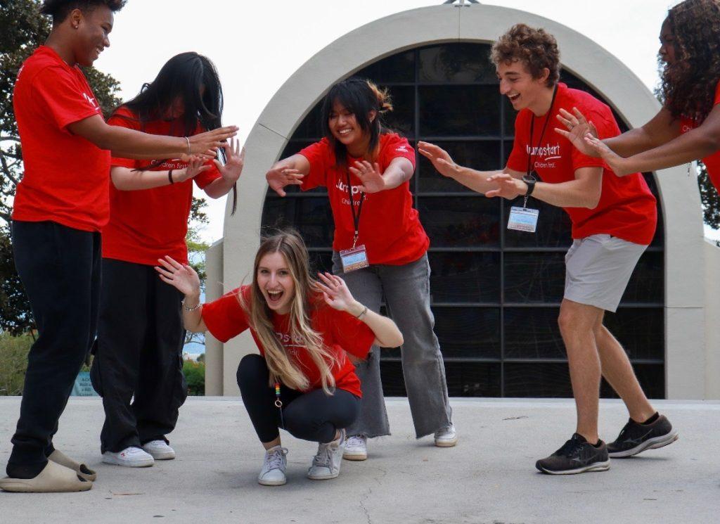 Jumpstart members surround Tahincioglu (center) as part of a spring training team bonding exercise March 2, 2024. All-day trainings are held once a semester for new and returning members to polish and renew their skills.