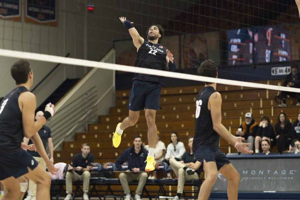 Freshman outside hitter Jose Gomez spiking the ball against Dominican University New York on Feb. 9 at Firestone Fieldhouse. Gomez led with 10 kills in the game.