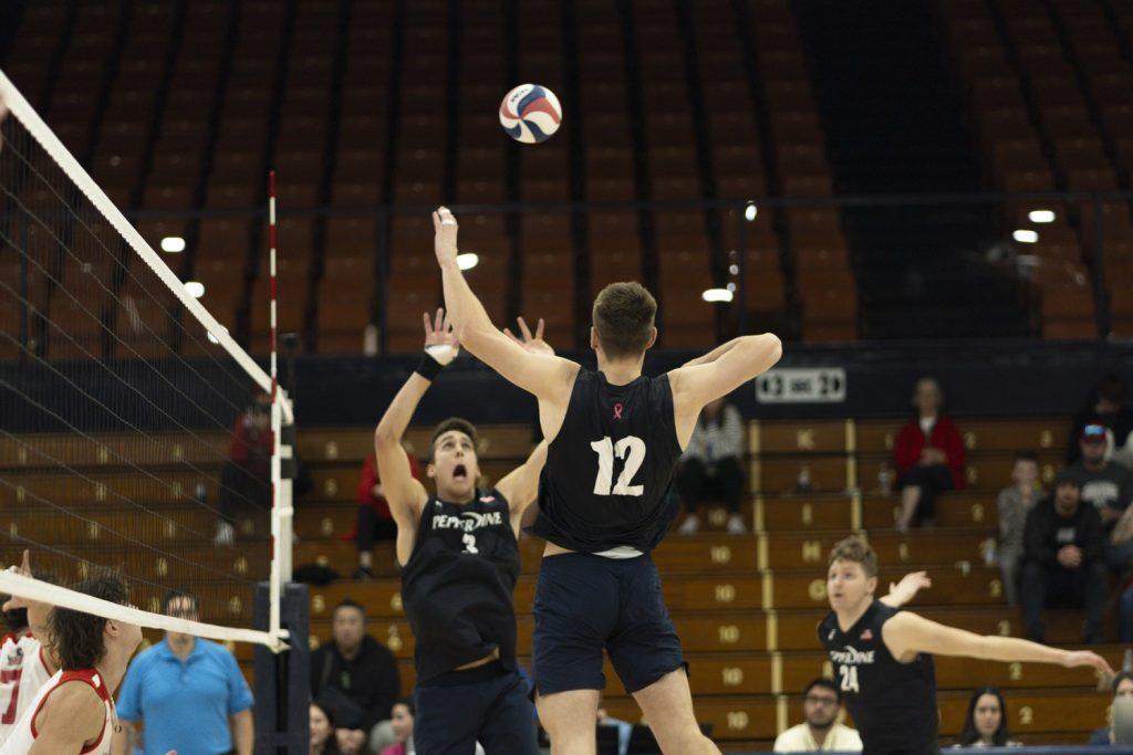 Freshman libero Zach Chapin setting the ball for Watson against Dominican University New York on Feb. 9 at Firestone Fieldhouse. Watson has a total of 41 kills on the season.