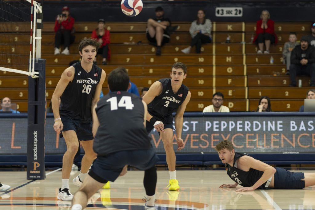 Junior outside hitter Ryan Barnett setting the ball for sophomore middle blocker James Eadie against Dominican University New York on Feb. 9 at Firestone Fieldhouse. Barnett has nine assists on the season. Photos by Kasten Grimm.