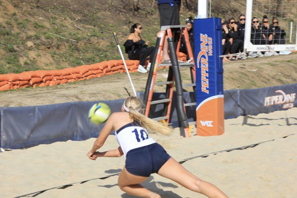 Redshirt sophomore Kenzi McSpadden dives for the ball against Bakersfield on Feb. 21 at the Pepperdine Beach Courts. The Waves opened their season 1-3 following the Pepperdine Challenge.