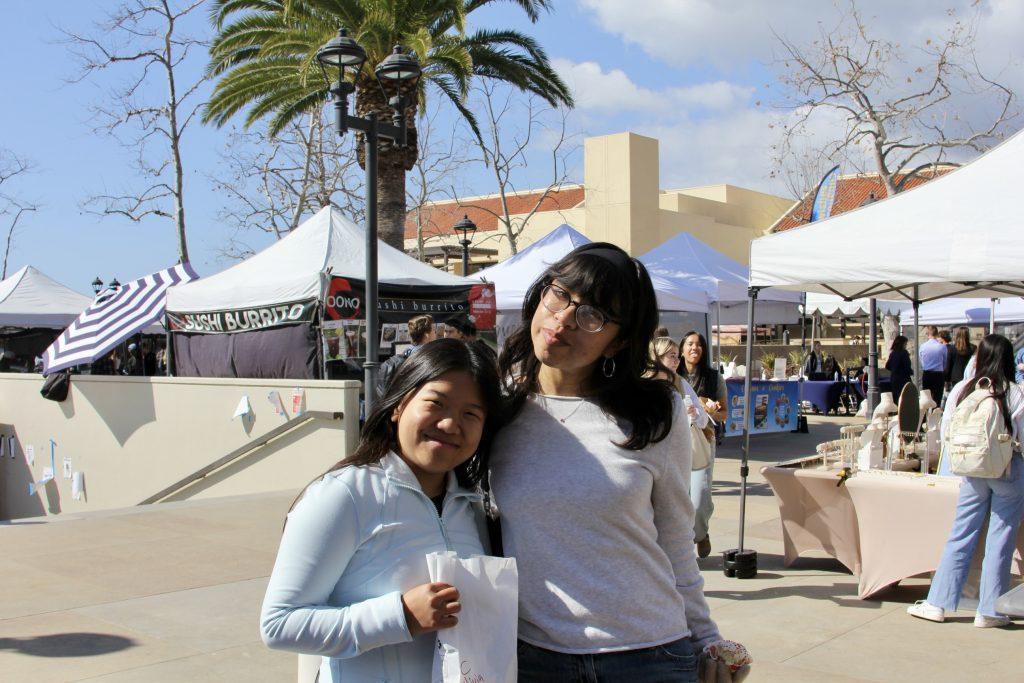 Olivia Schlossin and Sage Marron pose for a picture.