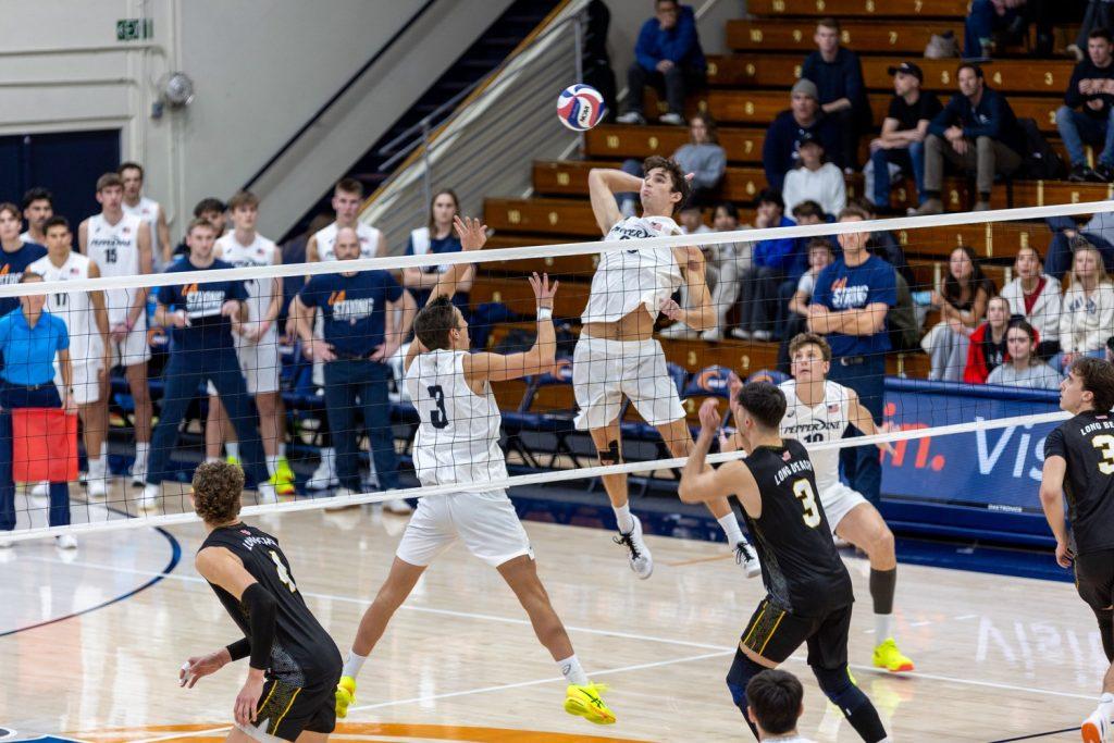 Graduate setter Gabe Dyer sets the ball for sophomore middle blocker James Eadie against Long Beach State on January 26 at Firestone Fieldhouse. Eadie finished the game with 10 kills.