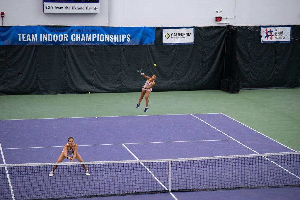 Broadus jumps off to a powerful serve with Yang ready to lock in for the play, exemplifying their experience and skill as they face off No. 75 ranked Tennessee doubles team at Combe Tennis Center on Feb. 8. With a score of 4-5, the game ended as unfinished.