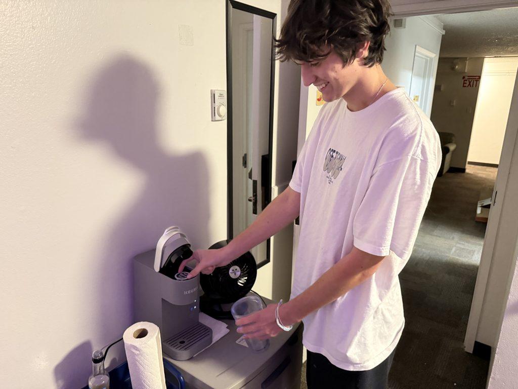 First-year Brett Blackburn makes a hot coffee in his dorm room Feb. 10. He said he has at least one cup a day to stay awake during his morning classes.