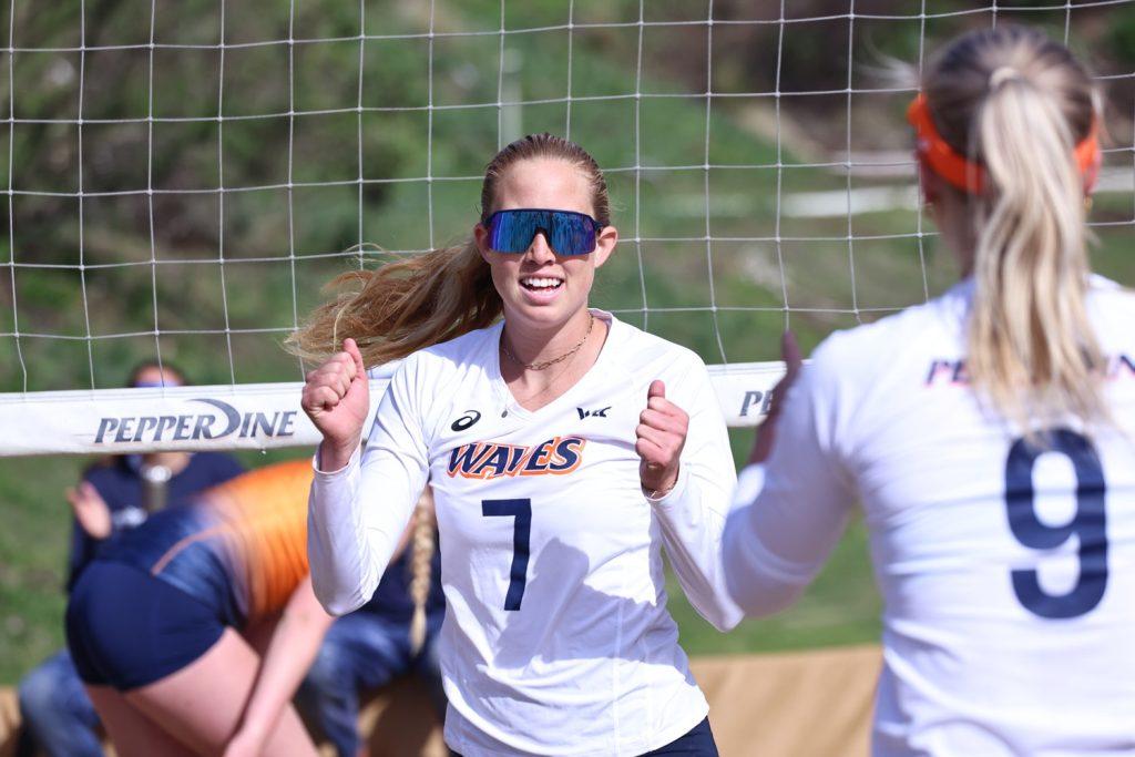 Junior Emi Erickson celebrates after a point against the University of Texas at El Paso on March 15 at the Pepperdine Beach Volleyball Courts. Erickson and her partner, redshirt freshman Deanie Woodruff, defeated their opponent in a 5-0 team win. Photo courtesy of Kennedy Duke