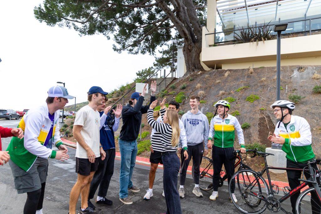 SGA President Myers Mentzer welcomes the group of Gamma Sigma Phi brothers when they arrived March 12 in the Chapel Lot. Mentzer said over 400 Pepperdine community members attended the welcome party. Photo by Sarah Dillion