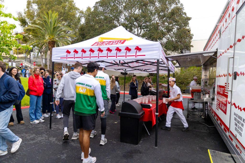 The Gamma Sigma Phi brothers grab food from an In-N-Out tent in the Chapel Lot after crossing the finish line. SGA provided food for everyone who attended. Photo courtesy of Sarah Dillion