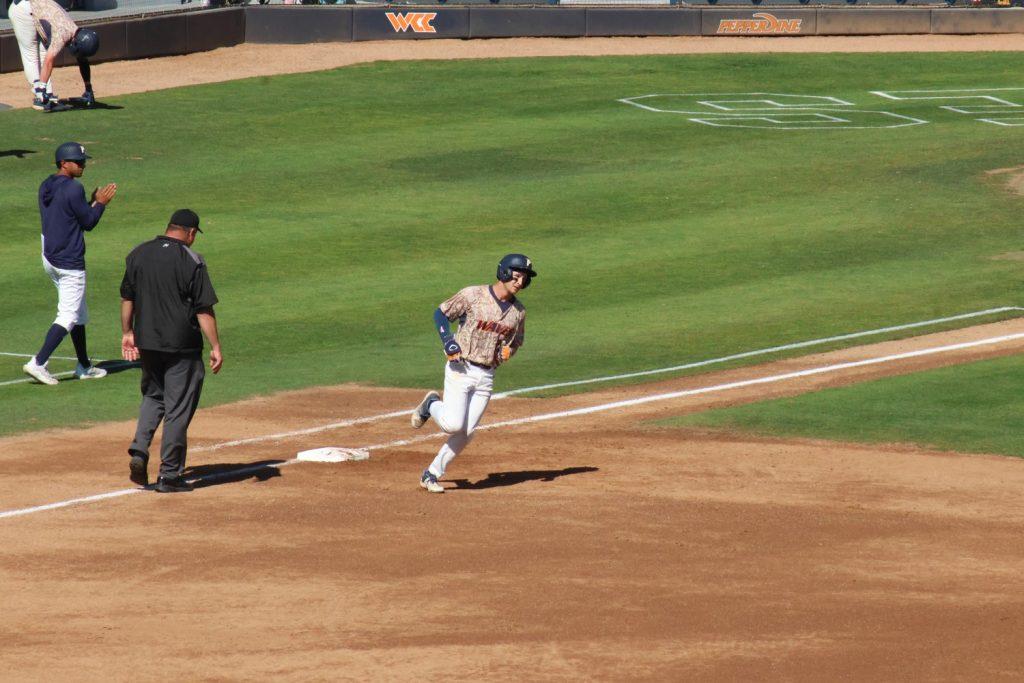 Freshman outfielder Joey Damelio rounds first base following a solo home run against the Huskers on March 19 at Eddy D. Field Stadium. This was Damelio's first homer of the season. Photo by Griffin Pilcher