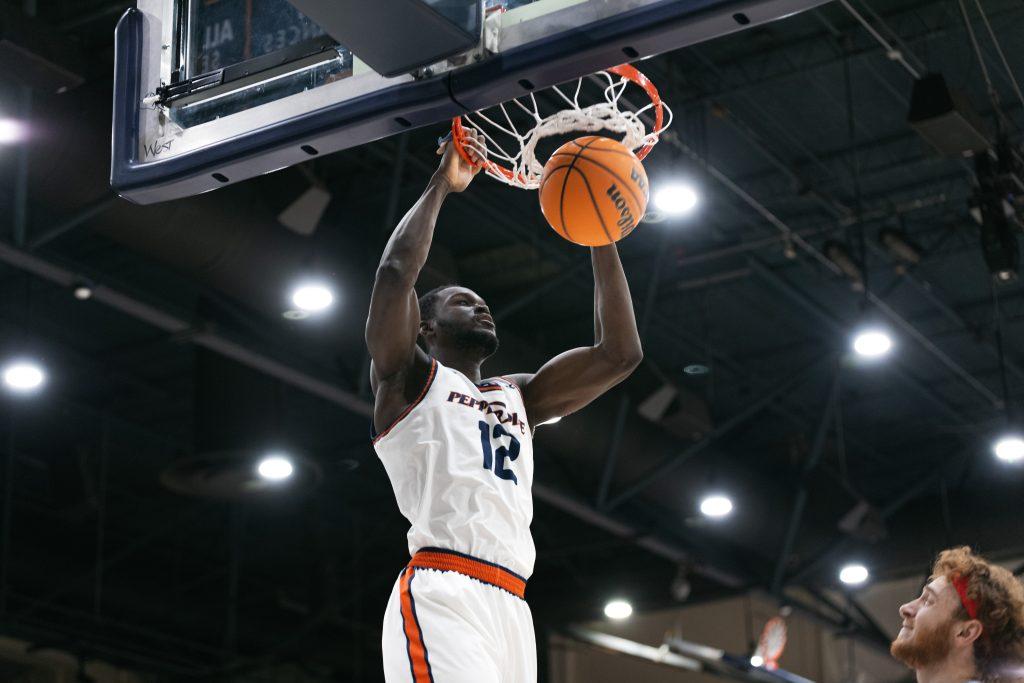 Redshirt senior forward Boubacar Coulibaly dunks the ball against Loyola Marymount University on Feb. 11, at Firestone Fieldhouse. Coulibaly leads the Waves in total rebounds and blocks for the season. Photo courtesy of Pepperdine Athletics