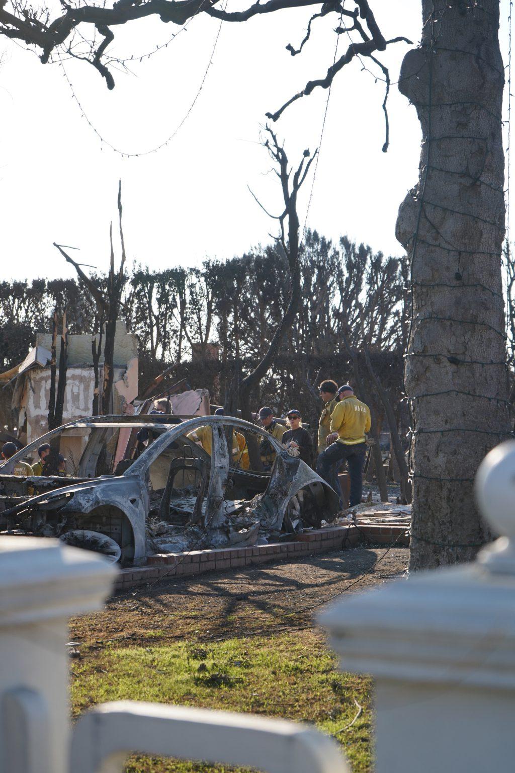 A burned electric vehicle sits following the Southern California wildfires. The EPA's Phase 1 removed such materials such as lithium-ion batteries. Photo by Liam Zieg