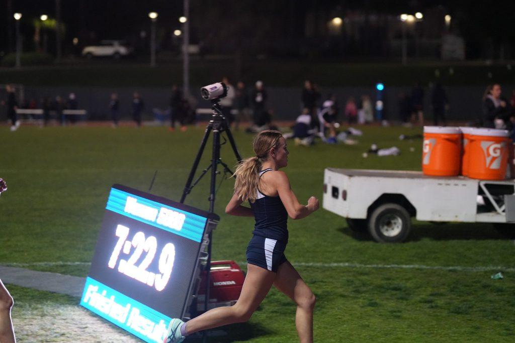 Sophomore Lizzy Crawford races at the Ben Brown Invite at California State University, Fullerton on March 7. Crawford shattered a 13-year-old record in the outdoor 3,000-meter run and holds the school record for the event in the indoor and outdoor season. Photo courtesy of Matt Burner