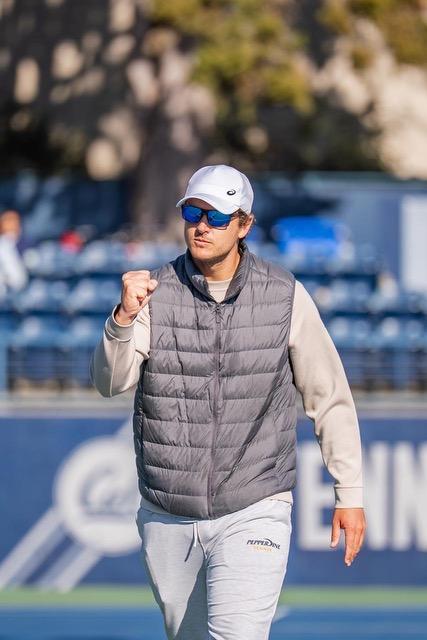 Schmid celebrates a point at the Hellman Tennis Center against the University of California, Berkeley on March 6. Schmid has led the team to six team wins so far this season.