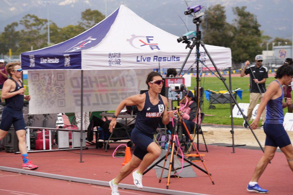 Sophomore Daniel Whitaker crosses the finish line the Sunshine Open in Santa Barbara on Feb. 8. Whitaker set the school record in the 60-meter dash. Photo courtesy of Daniel Whitaker