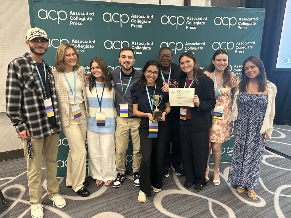 Members of the Graphic staff pose with a member of the Associated Collegiate Press (ACP) after winning first place for Best Newspaper/Newsmagazine at the ACP Conference in Long Beach on March 8. Life & Arts Editor Amanda Monahan (third from right) said the conference as an experience to support and be supported by other student journalists. Photo courtesy of Gabrielle Salgado