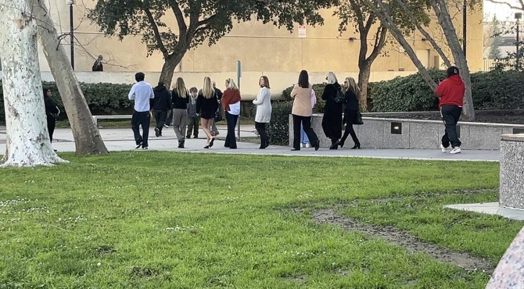 Friends and family of Fraser Michael Bohm gather outside the courthouse following the March 17 hearing, where a judge denied the motion to dismiss his murder charges.