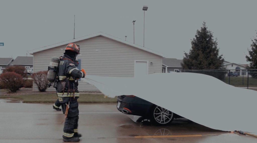 Firefighters deploy a fire suppression blanket during training. Fire suppression blankets work to smother flames and contain fumes. Image courtesy of Brimstone Fire Protection