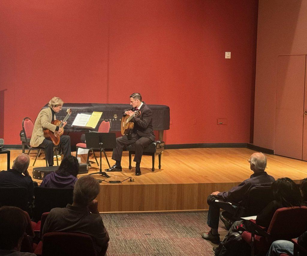 Distinguished Professor of Music Christopher Parkening (left) demonstrates a song for a classical guitar student during a master class in Raitt Recital Hall. Some audience members at the session took notes throughout the four hours of teaching. Photos courtesy of Christopher Parkening