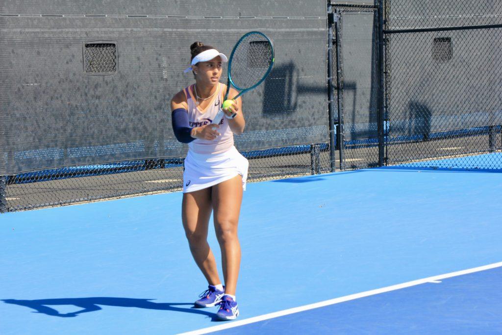 Broadus prepares for a serve in her singles match against the California Bears during a 5-2 Waves win at the Ralphs-Straus Tennis Center. Broadus is currently No. 8 in the country for singles and defeated her opponent 6-2 Feb. 22.